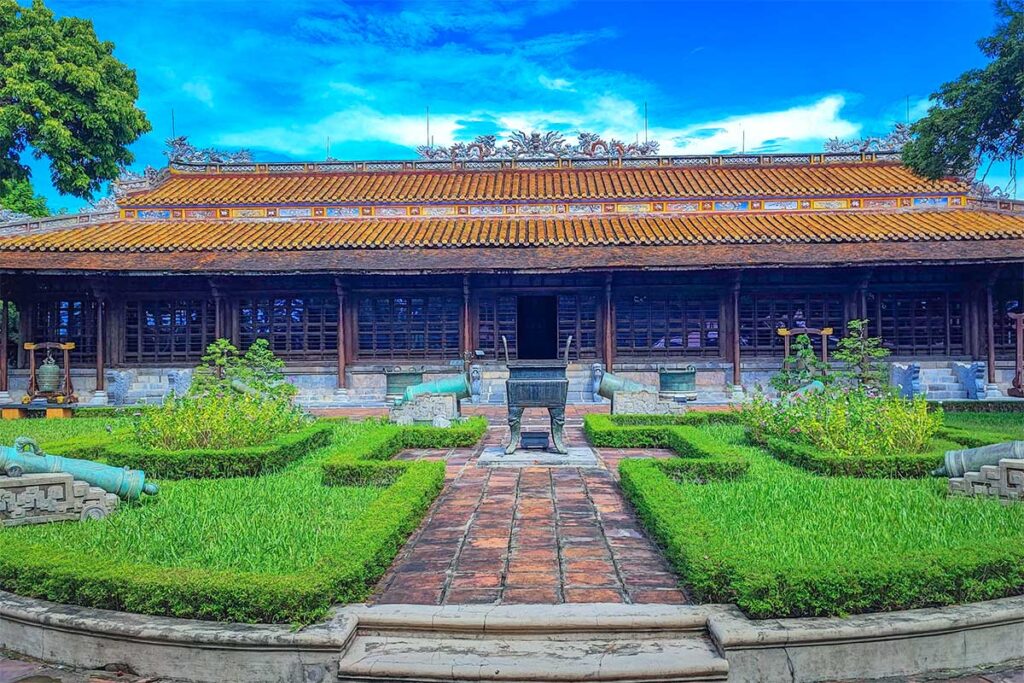 Long An Palace seen from the outside with small garden in front in Hue and now used as museum