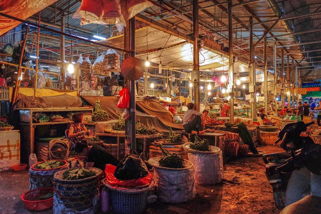 Wholesale stalls at the Long Bien Market at night