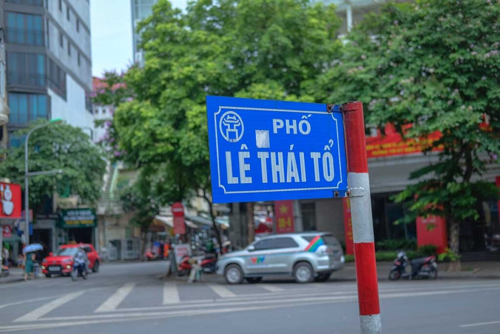 A street sign with the name "Ly Thai To" in Hanoi
