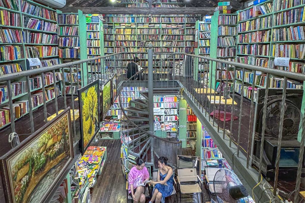 Inside of Mao Bookstore with the spiral staircase and boos everywhere