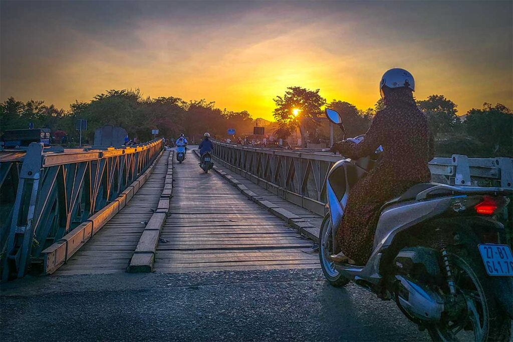A motorbike is crossing the Muong Thanh Bridge