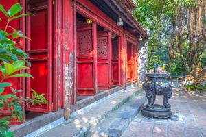 Close-up of the main temple hall doors and incense burner at Ngoc Son Temple
