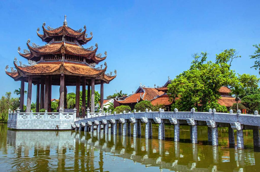 A small shrine in the middle of a pond at Nom Pagoda