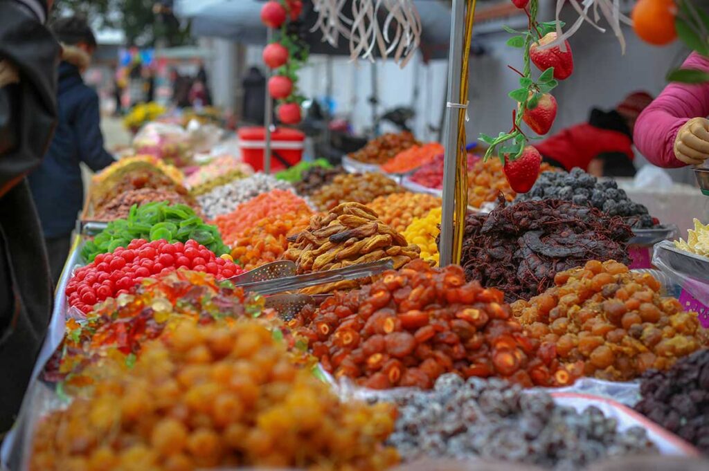 Stalls on the streets of Hanoi selling O Mai (Preserved Fruits)