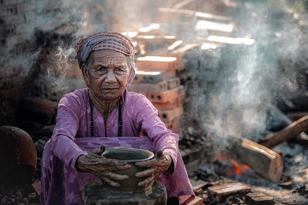 Old woman Vietnam doing traditional pottery production in Phu Lang village,Bac Ninh province,Vietnam