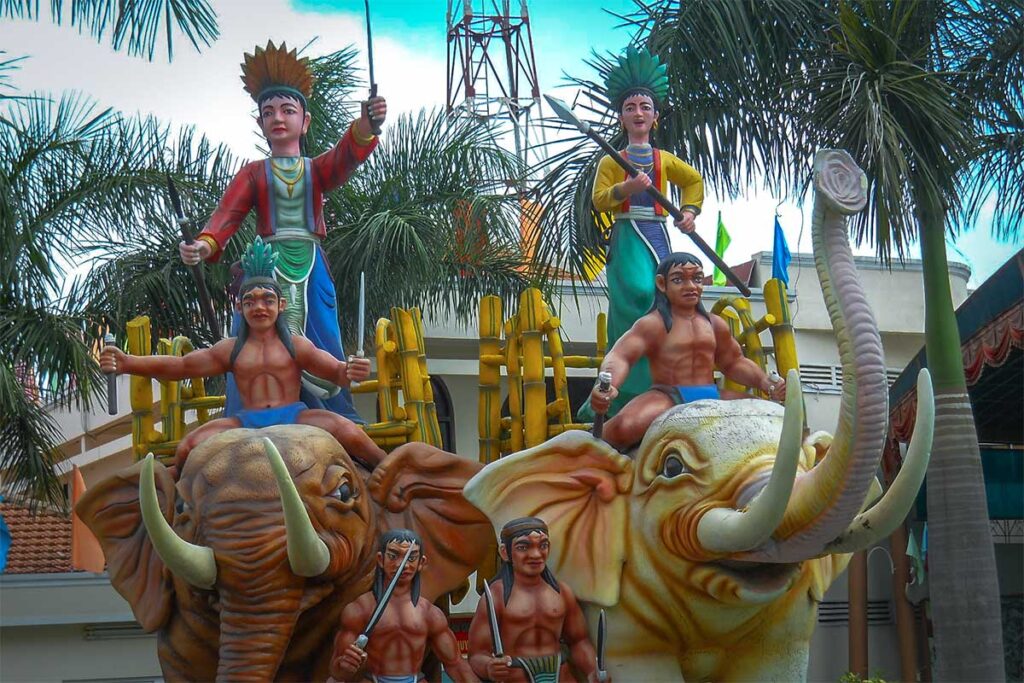 A colorful statue of the Trung Sisters riding an elephants at Suoi Tien Park 