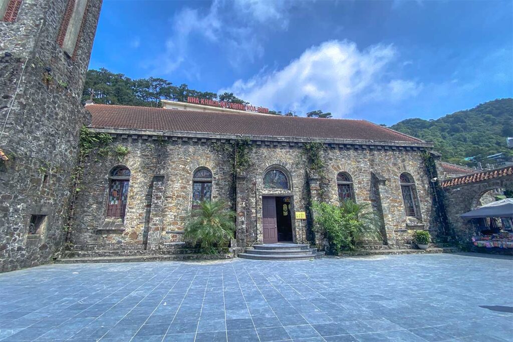 A small courtyard with main stone church building in Tam Dao