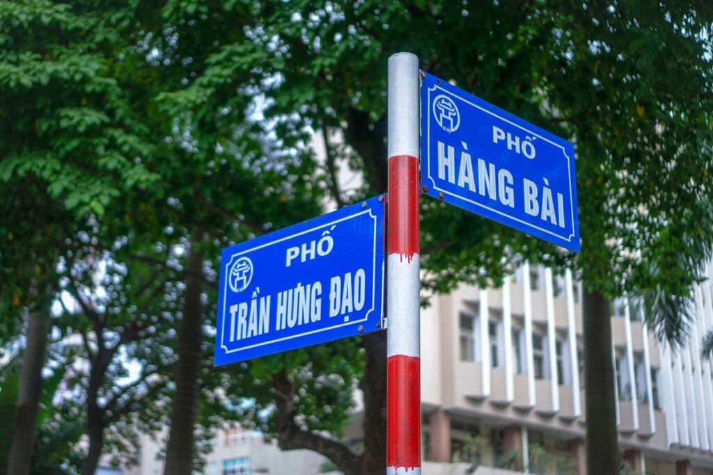 A street sign in Hanoi with the name " Tran Huong Dao " on it