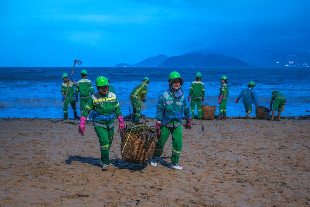 Beach cleaners start right after a typhoon in Vietnam to clean the beach