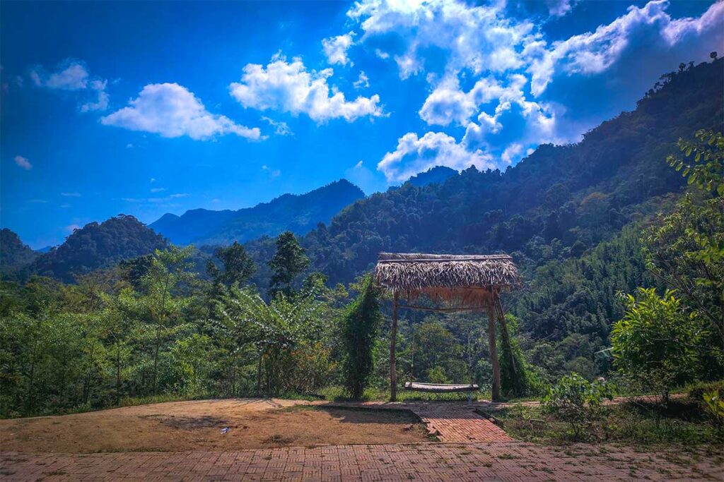 A swing facing a stunning mountain view with forest in Van Ho District in Chien Yen
