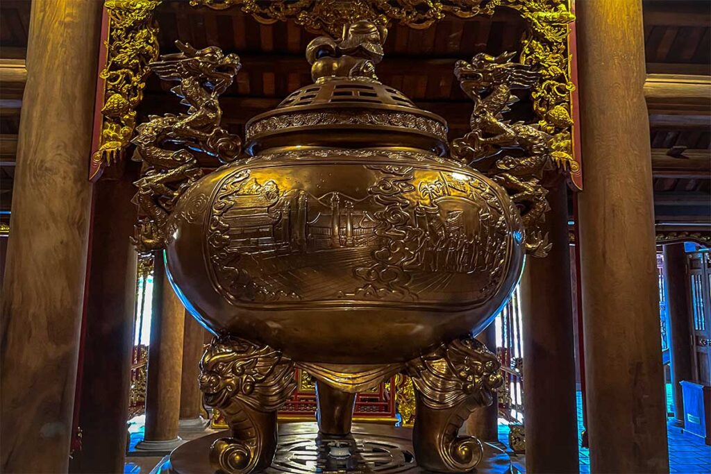 A large bronze incense burner inside a temple at Xuong Giang Citadel
