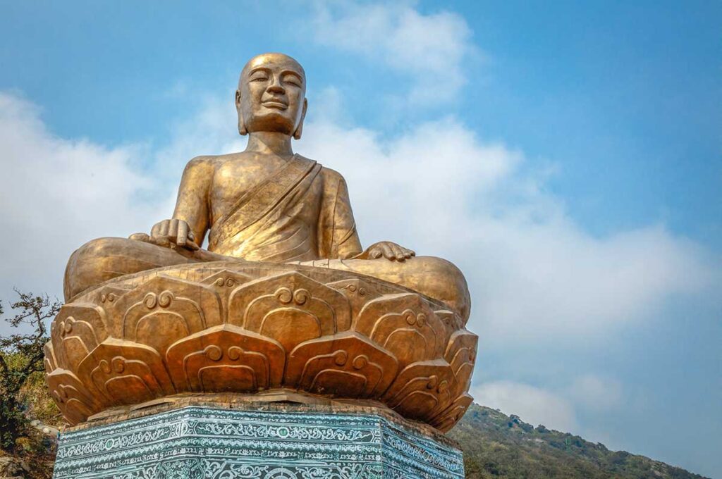 A golden buddha statue on Yen Tu Mountain part of  the temple complex