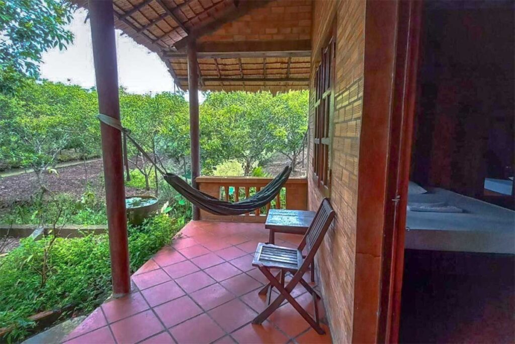 A bungalow style homestay with hammock facing the garden located on An Binh Island in the Mekong Delta