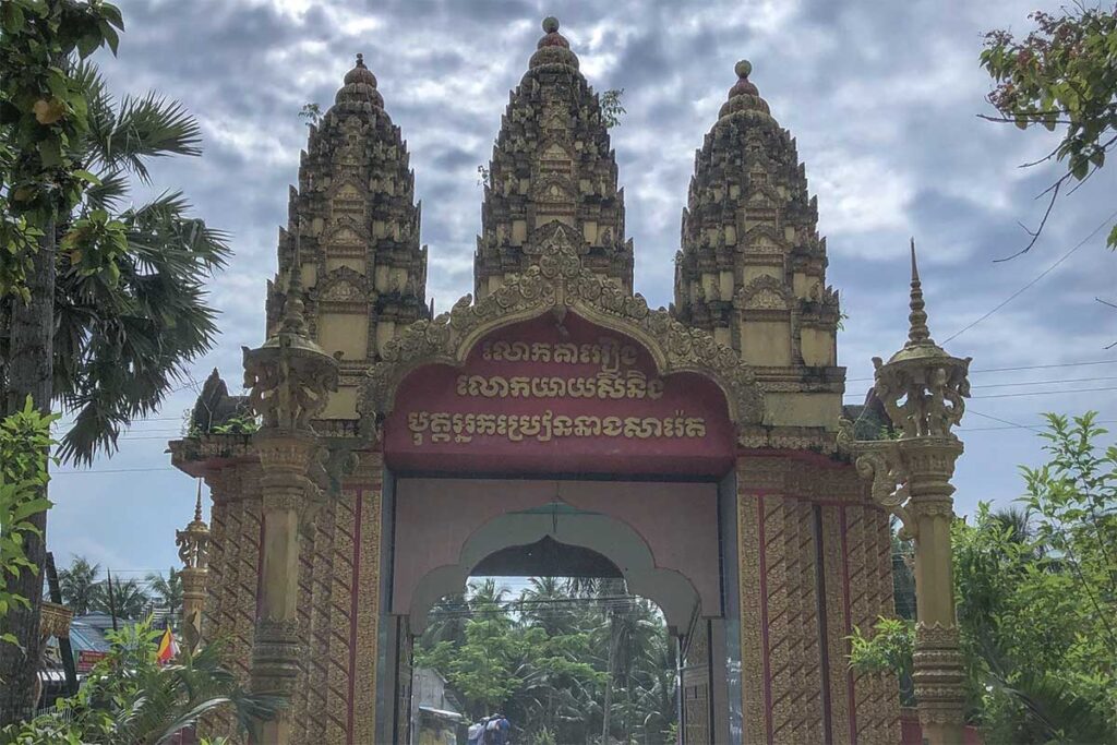 Khmer-style entrance gate of Ang Pagoda in Tra Vinh with three towers and detailed carvings