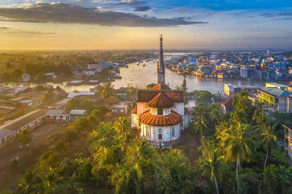 The back of Cai Be Church seen from the air with the river in the background