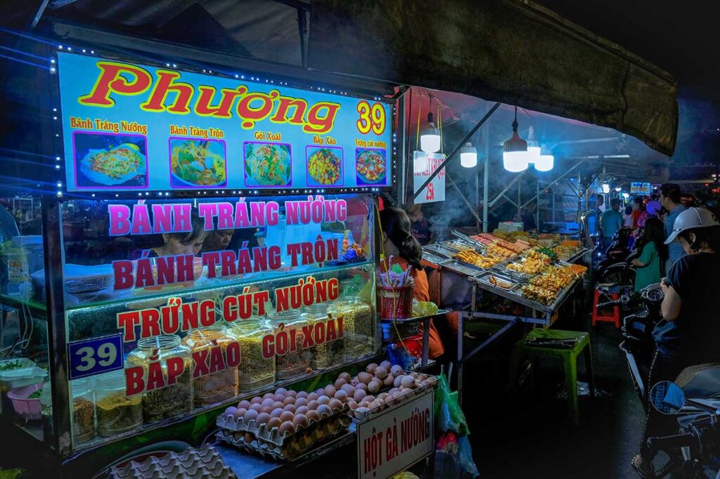 A stall selling street snacks at the Ninh Kieu Night Market (Can Tho Night Market)