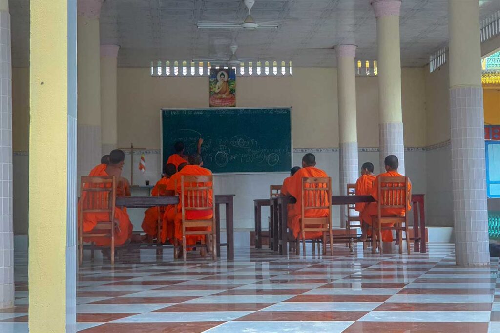 Khmer monks in orange robes studying at Hang Pagoda school in Tra Vinh.