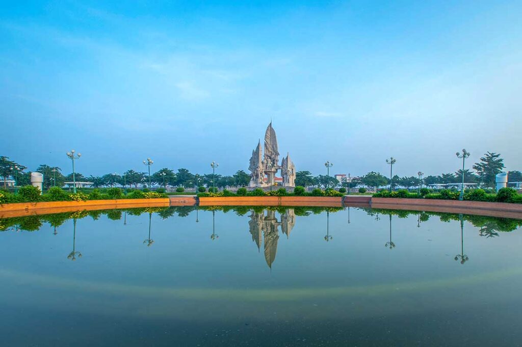 Chuong Thien Victory Monument in Hau Giang Province, Vietnam – large war memorial reflected in a pond at Monument Park in Vi Thanh City.