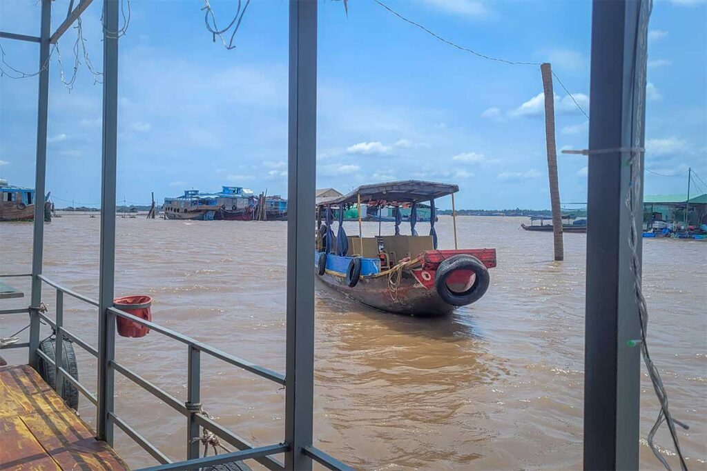 Small passenger boat approaching Dragon Island (Tân Long) on the Tiền River, Tien Giang Province.