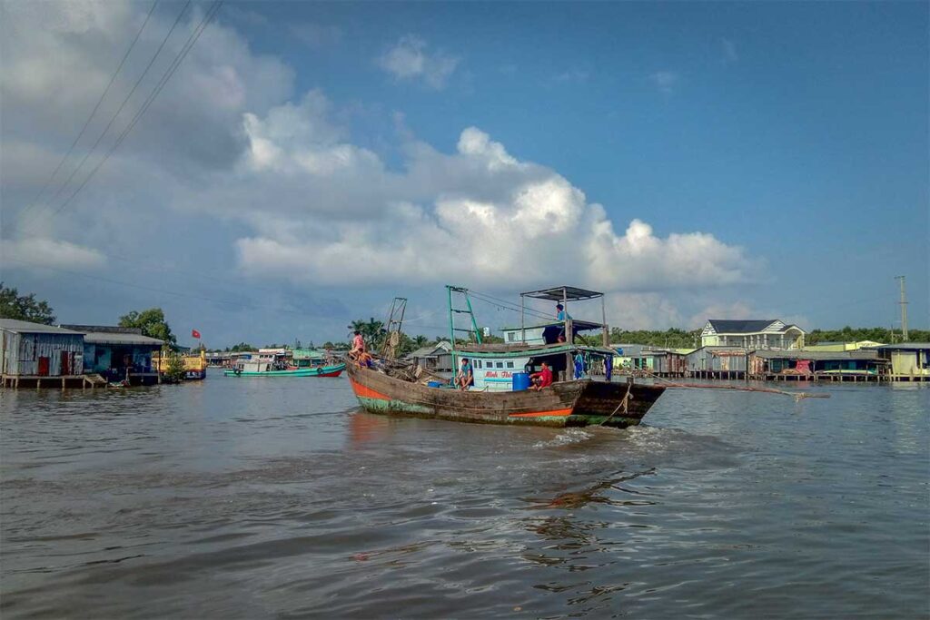 A small wooden fishing boat at a local fishing village at Cape Ca Mau