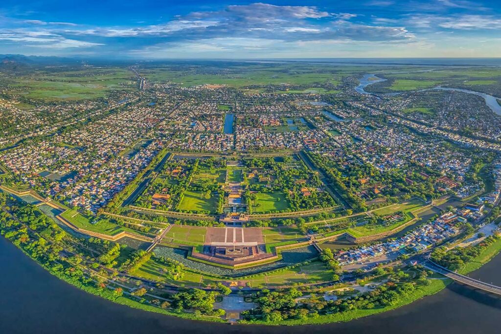 Hue Citadel seen from aerial view with Perfume River on the foreground