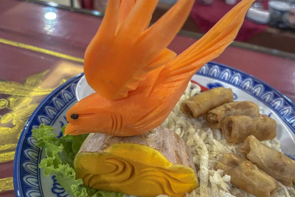 Hue royal food - A Vietnamese dish with spring rolls decorated beautiful with a bird made out of a carrot