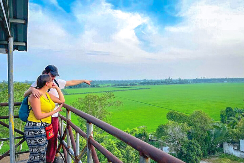 Couple enjoying the panoramic view of rice fields from the reserve’s observation tower.