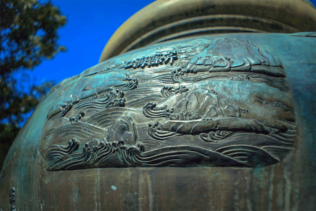 A closeup of one of the carvings on one of the nine dynastic urns standing in Hue Imperial City