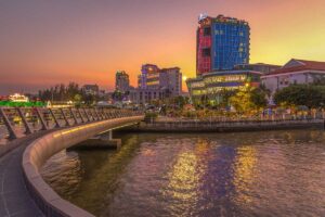 Ninh Kieu Wharf seen from Can Tho Walking Bridge during sunset with red sky