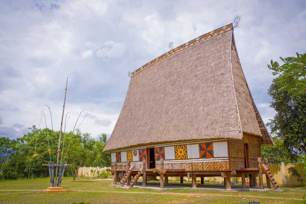 Traditional Central Highlands communal house (Nha Rong) at Quang Trung Museum in Binh Dinh, showcasing ethnic architecture and cultural heritage.