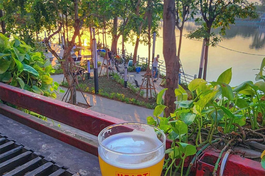A beer on the foreground from Standing Bar on Ngu Xa Island overlooking Truc Bach Lake