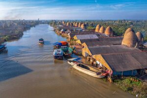 Canal in Vinh Long with many stone mushroom shaped brick kilns