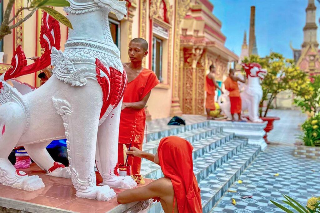 Monks are busy with maintenance and painting statues inside Xiem Can Pagoda
