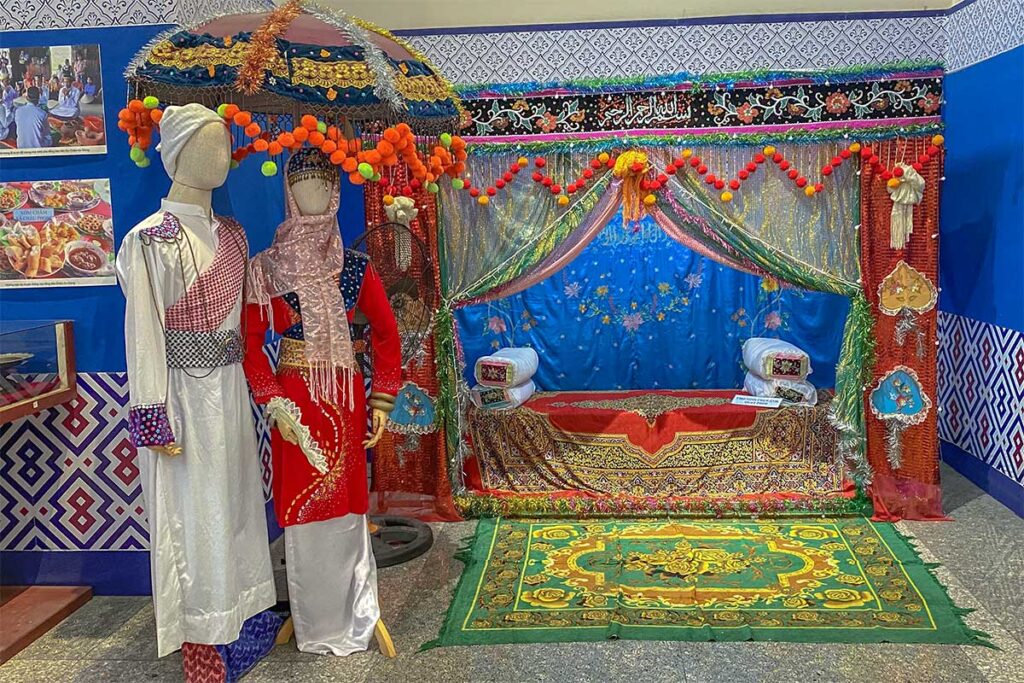 Cultural display at An Giang Museum in Long Xuyen – Traditional Cham costumes and wedding decorations exhibited inside An Giang Museum.