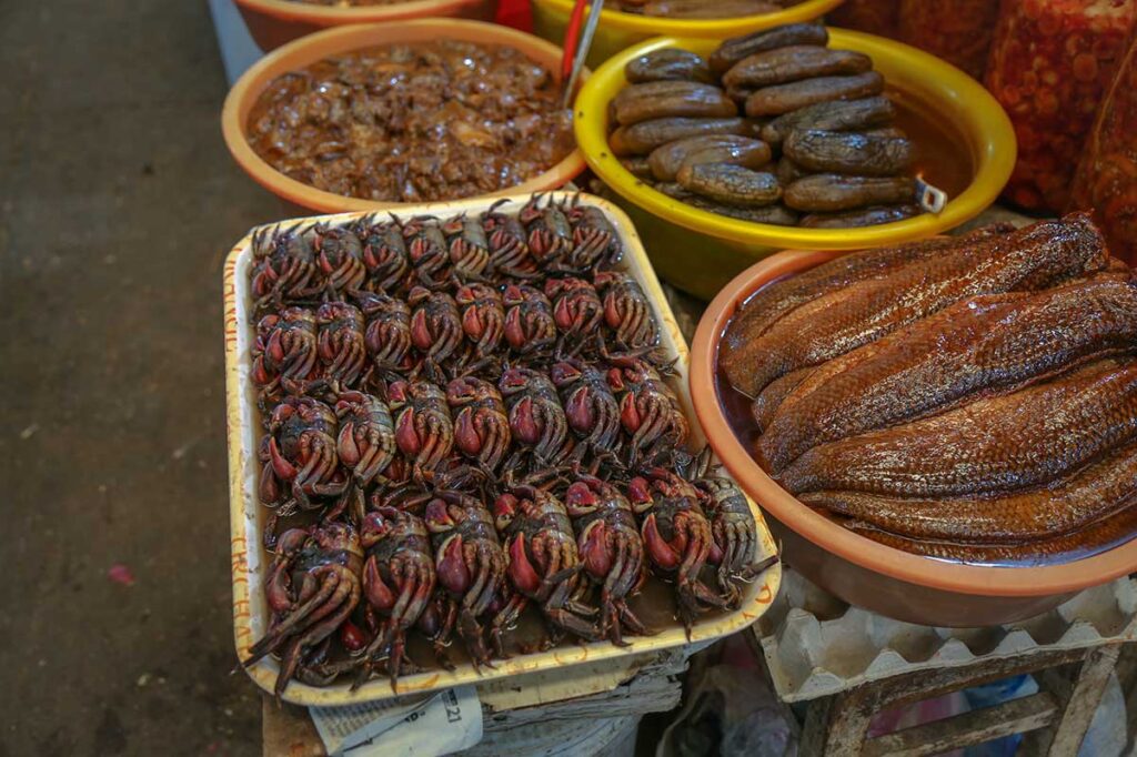 Close-up of preserved seafood and river crabs for sale at Cai Khe Market in Can Tho