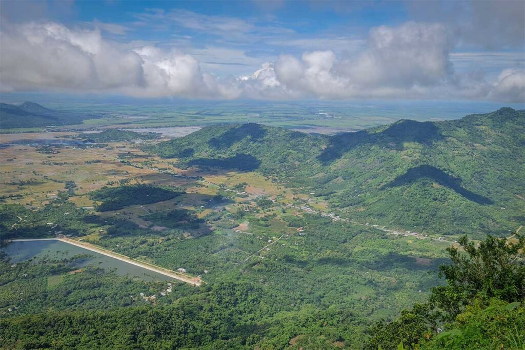 Landscape from Bo Hong Peak – Scenic view from Bo Hong Peak, the highest point of Cam Mountain, looking over farmland and hills in the Mekong Delta.