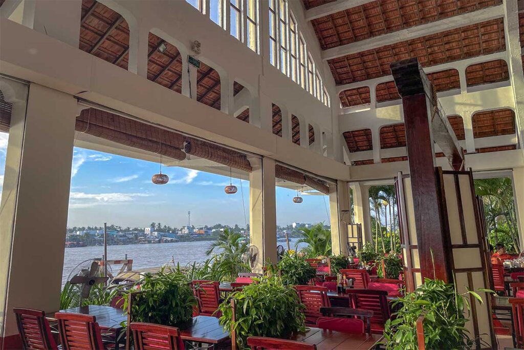 Upstairs restaurant inside Can Tho Market with locals dining and views of the Hau River