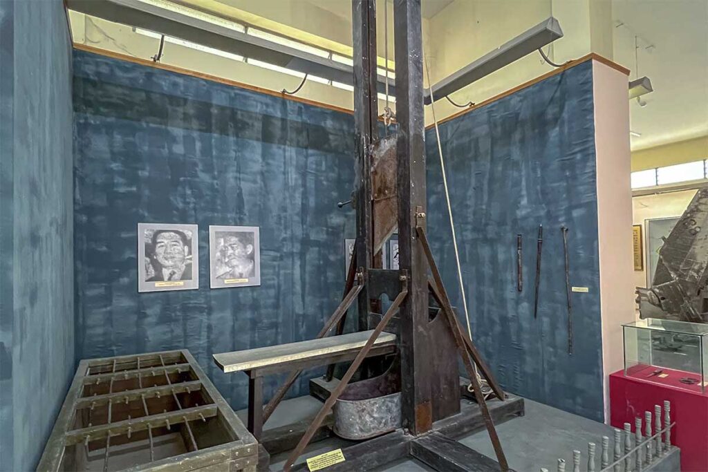French colonial guillotine displayed at Can Tho Museum, a stark reminder of Vietnam’s resistance history.