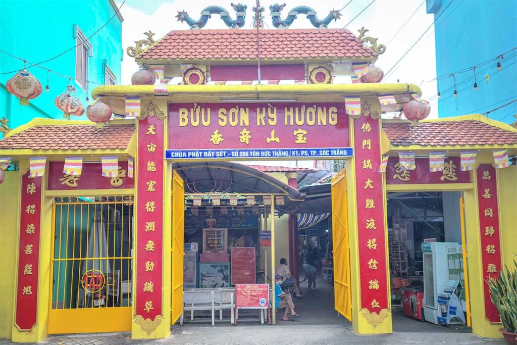 Clay elephant and lion statues inside Clay Pagoda – White six-tusked elephant and guardian lion among other clay works inside the temple.