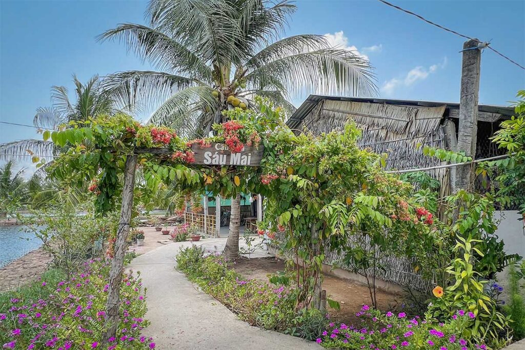 Entrance to a local family eatery decorated with flowers on Con Chim Island, Tra Vinh, part of its community-based tourism model