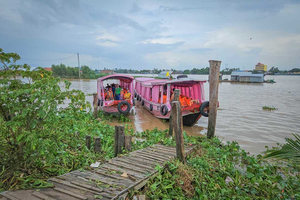 Passenger boats at Cô Bắc Wharf ready to ferry visitors across the Hau River to Con Son Islet, Can Tho