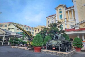 Courtyard of Military Zone 9 Museum with a tank, missile, and other war relics