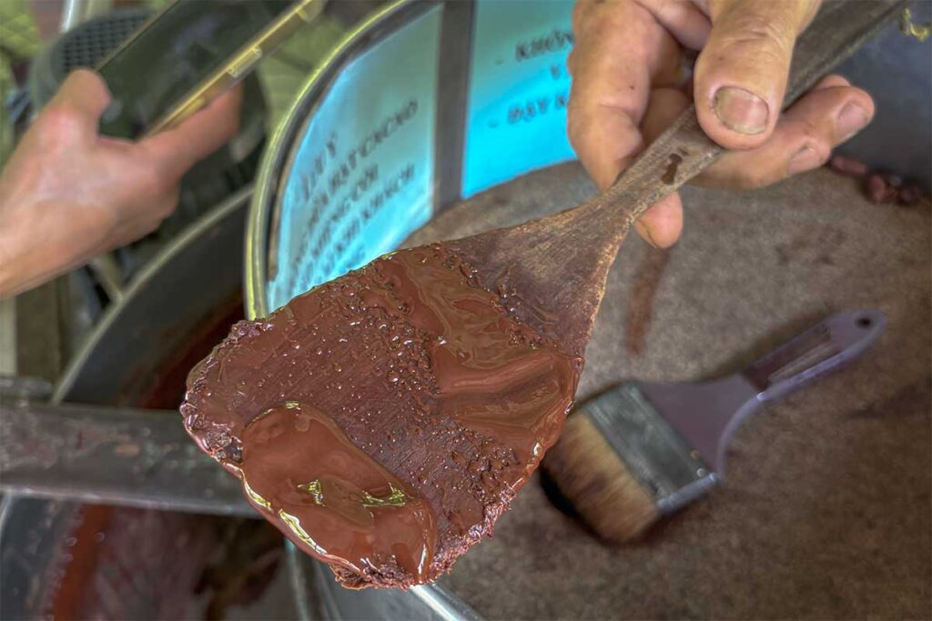 Freshly ground melted chocolate shown during the workshop at Muoi Cuong Cacao Farm in Can Tho