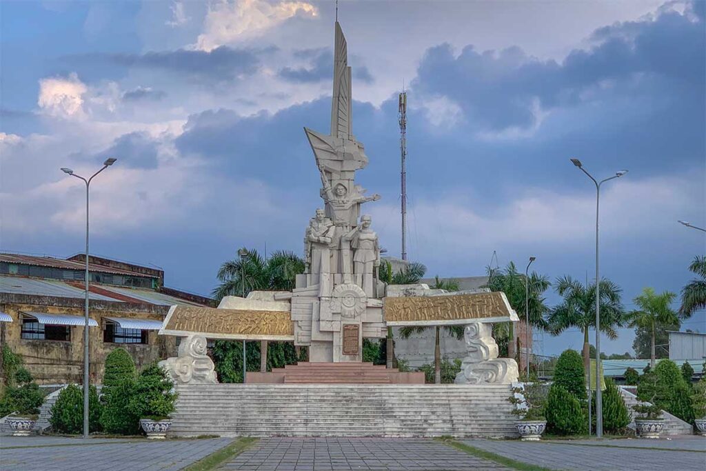 Nga Nam Victory Monument, a historic landmark by the canal in Soc Trang.