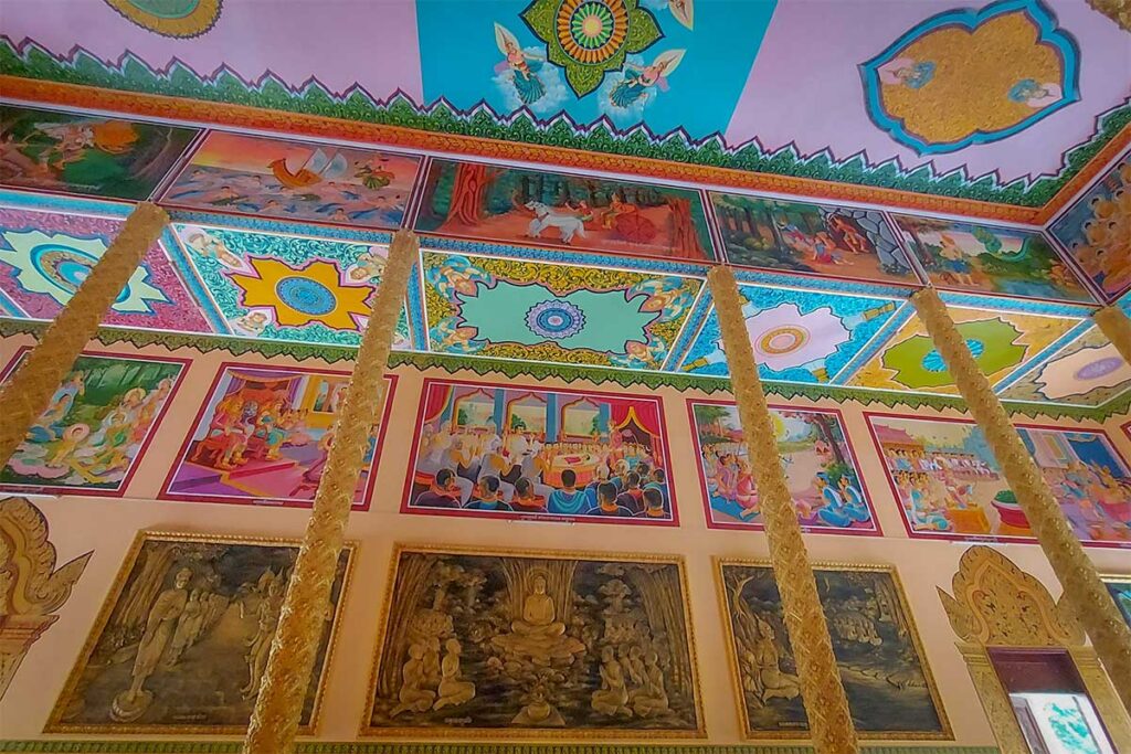 Ceiling and wall paintings at Nodol Pagoda in Tra Vinh, depicting Buddhist stories in bright Khmer artistic style
