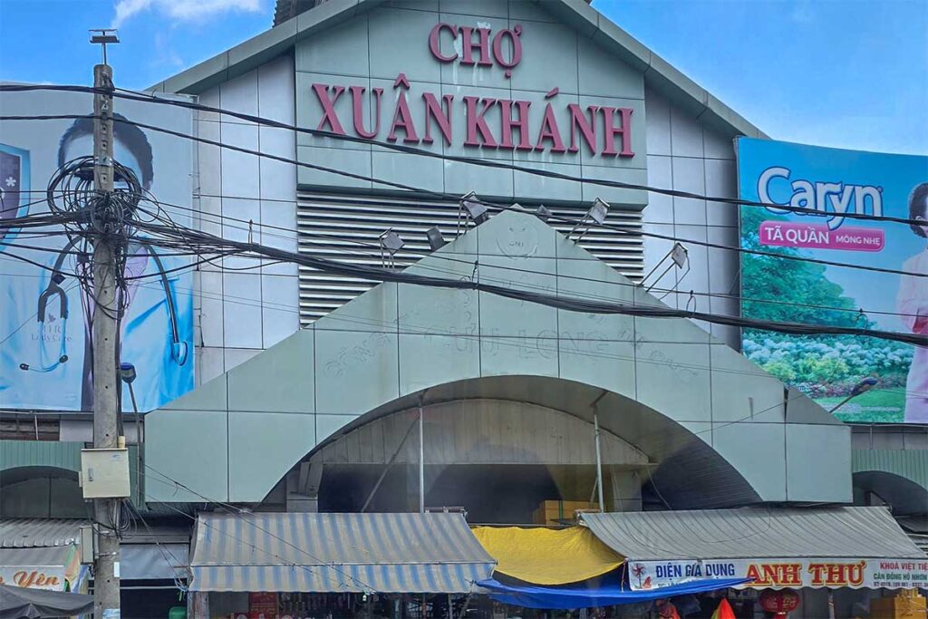 Exterior of Xuan Khanh Market in Can Tho with market entrance and signage