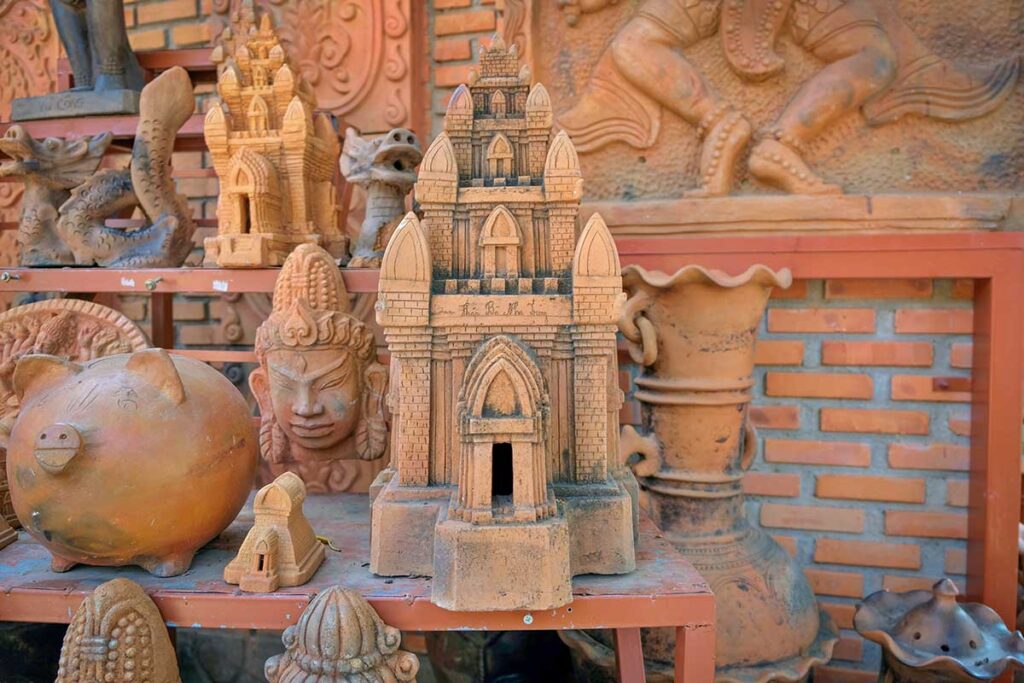 Cham tower-inspired terracotta sculpture and decorative pottery on display in Bau Truc Pottery Village, Vietnam.