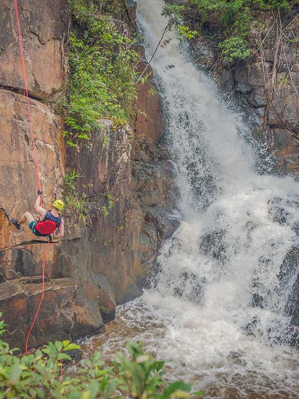 Canyoning in Dalat – Local Vietnam tours | waterfall descent experience surrounded by lush forest in the Central Highlands