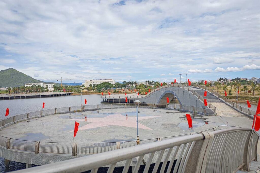 Ho Son Park in Tuy Hoa with its central lake, pedestrian bridge, and landscaped public space.