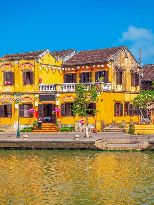 Hoi An Ancient Town – Local Vietnam tours | colorful yellow merchant houses along the Thu Bon River in Hoi An